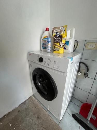 a washing machine in a corner of a room at Adelina House in Olbia