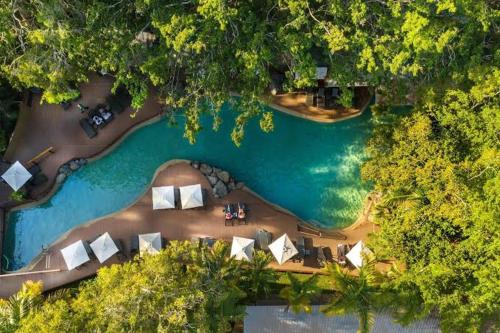 an aerial view of a beach with a group of resorts at Salty waves - D246 in Port Douglas