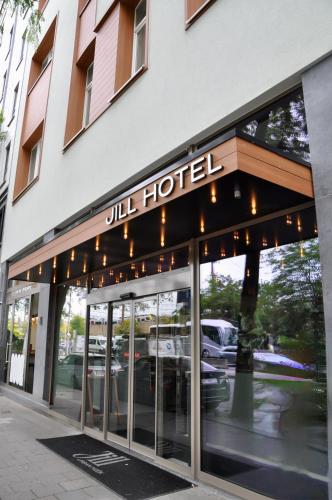 a building with a hotel sign on the front of it at Jill Hotel Brussels in Brussels