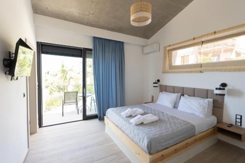 Una cama o camas en una habitación de Villa Skalia Lefkada