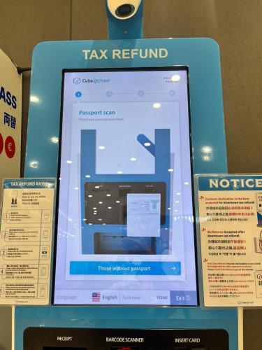 a sign for a tax return in a store at Gate303 in Seoul