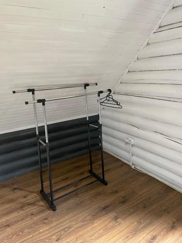 a shelf in a room with a white wall at Котеджі Віват in Oryavchyk