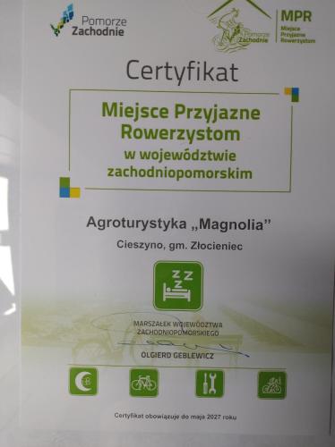 a sign that says mitschke pharmacyuranceuranceemption at Agroturystyka Magnolia in Cieszyno