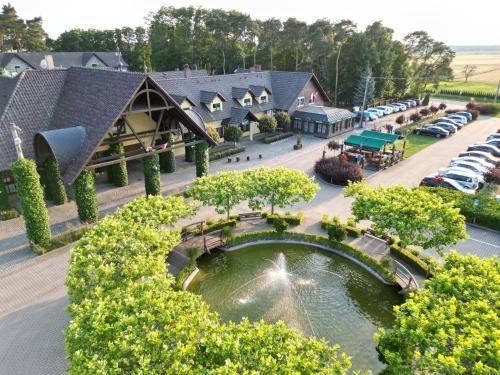 an aerial view of a resort with a pond at Hotel Wawrzyniak in Zduny