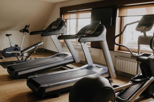 a group of five tread machines in a gym at Hotel Wawrzyniak in Zduny