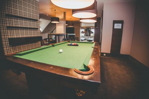 a billiard table in a room with afits at Hotel Wawrzyniak in Zduny