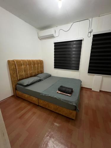 Giường trong phòng chung tại Homestay Losong Kuala Terengganu