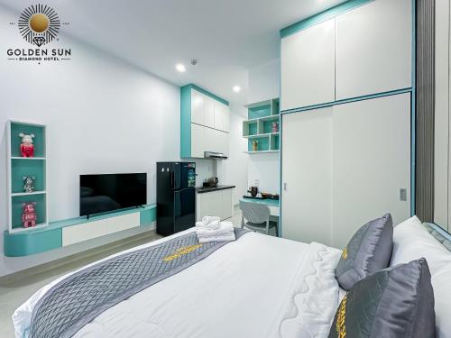 a bedroom with a large bed and a flat screen tv at Golden Sun Hotel Apartments 5 in Ho Chi Minh City