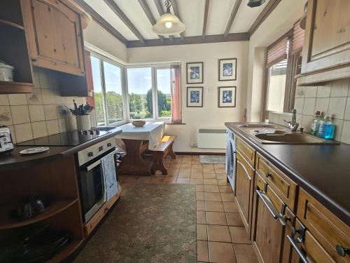 a kitchen with a sink and a stove top oven at 3 Bed in Goathland oc-c32364 in Goathland