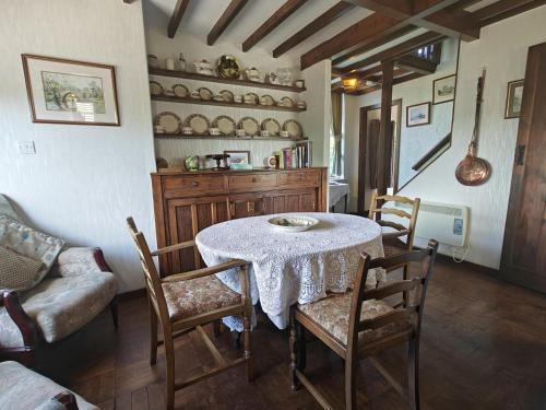 a dining room with a table and chairs at 3 Bed in Goathland oc-c32364 in Goathland