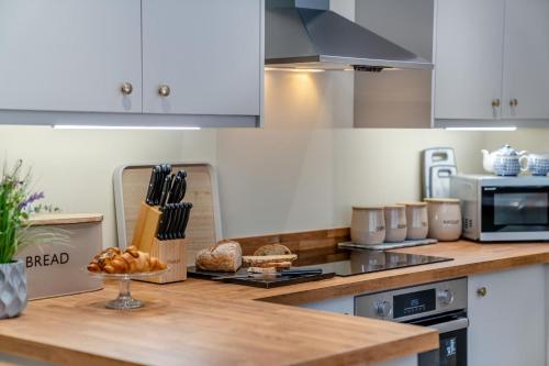 a kitchen with a counter top with bread on it at 3 Bed in Reeth oc-l32438 in Reeth