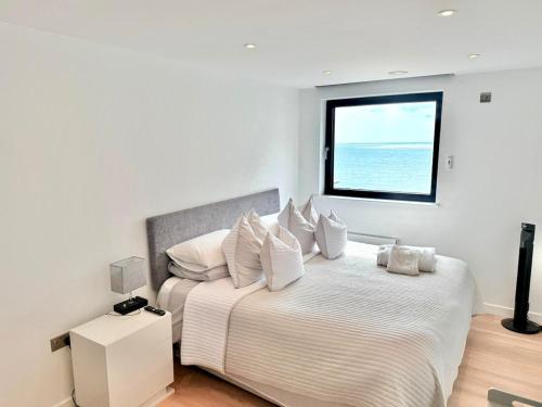 a bedroom with two beds and a window at The Lookout-Sea Views-Balcony-Free parking in Ramsgate