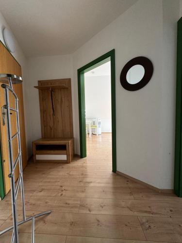 a room with a door and a mirror on the wall at Penzion-apartmán Souček in Jindrichuv Hradec