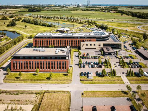an overhead view of a building with a parking lot at Van der Valk Hotel Middelburg in Middelburg