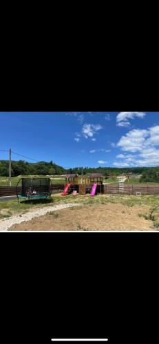 a park with a playground with a slide at VictoriA-Frame in Nucşoara
