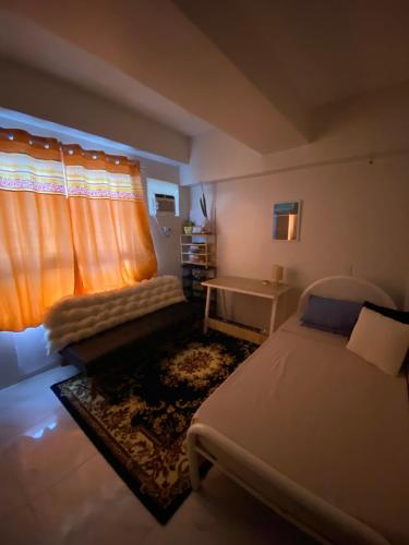 Ένα ή περισσότερα κρεβάτια σε δωμάτιο στο Room condo Guadalupe, Banawa Cebu City