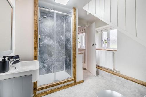 a bathroom with a shower and a sink at 2 Bed in Troutbeck oc-b32579 in Troutbeck