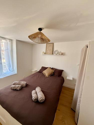 Ένα ή περισσότερα κρεβάτια σε δωμάτιο στο Appartement