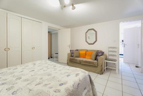 Ένα ή περισσότερα κρεβάτια σε δωμάτιο στο Charmant Appartement De Plein Pied