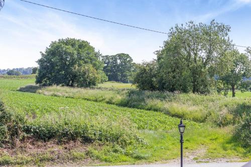 a street light next to a field with trees at 2 Bed in Carreghofa oc-t32530 in Llanymynech