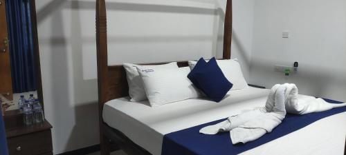 Postel nebo postele na pokoji v ubytování Oleena Home Stay
