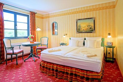 Postel nebo postele na pokoji v ubytování Hotel Godewind