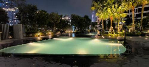 an empty swimming pool in a city at night at Agile super suite KLCC in Kuala Lumpur