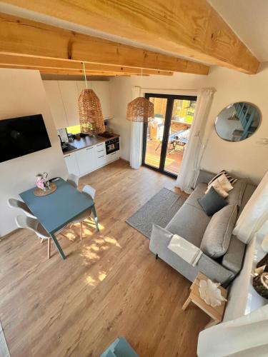 a living room with a couch and a table at Chata Břeh in Louka