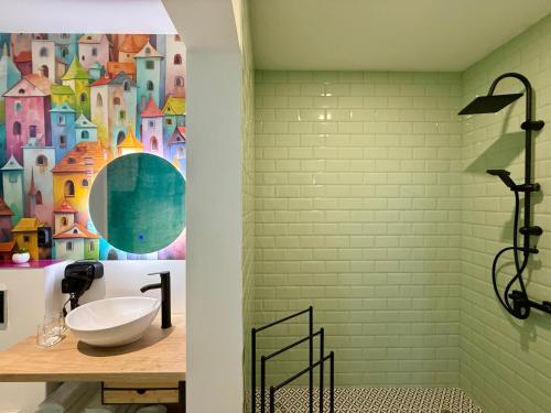 a bathroom with a sink and a wall mural at Eclectic 6 in Satu Mare