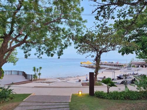 a view of a beach with a pier at Mactan Newtown Ocean View 360 Degree in Mactan