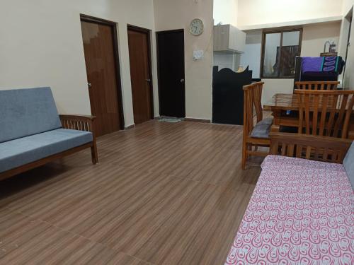 a living room with a couch and a table at Gail Villa Igatpuri in Igatpuri