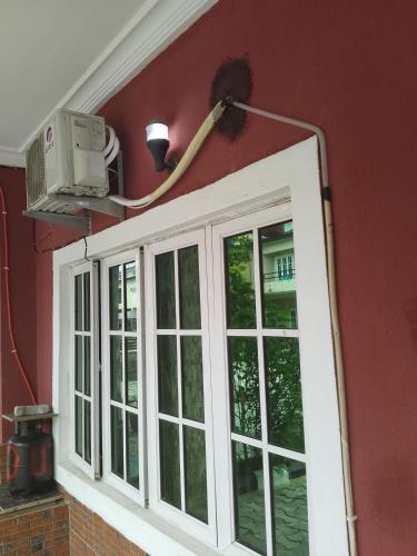 a room with a window and a light on the wall at Peace Home in Lekki
