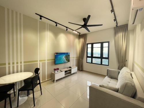 a living room with a couch and a table at Central Park Damansara Near KPJ, 1Utama, The Curve by The Homez in Petaling Jaya