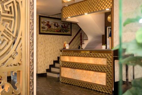 a hallway with a stairway with a mirror at CHIEN CONG Hotel in Ha Long