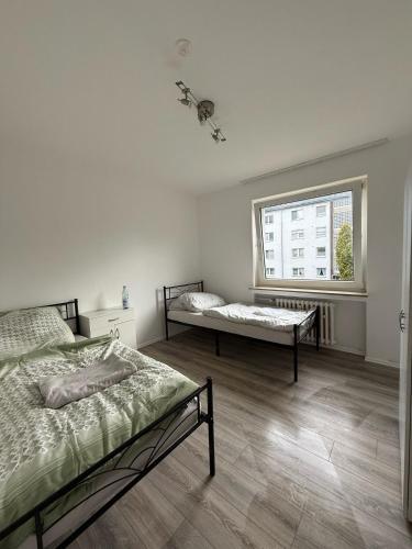 En eller flere senge i et værelse på Monteurwohnung bei Köln,Düsseldorf WLAN, Parkplatz, Küche, Handtücher