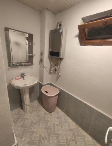 a bathroom with a sink and a toilet at Ulduzlu ev in Sheki