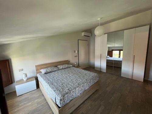 a bedroom with a bed and a large mirror at La Graziosa in Arezzo