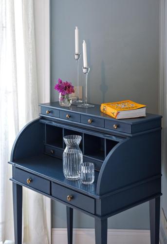 a blue dresser with a vase on top of it at Villa Mabel Boutique Hotel in Taormina