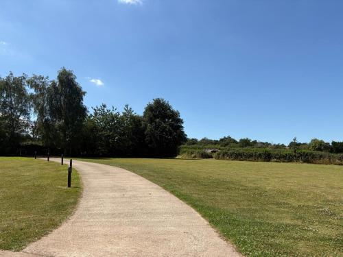 a path in the middle of a grass field at Portbridge Nest in Chew Magna