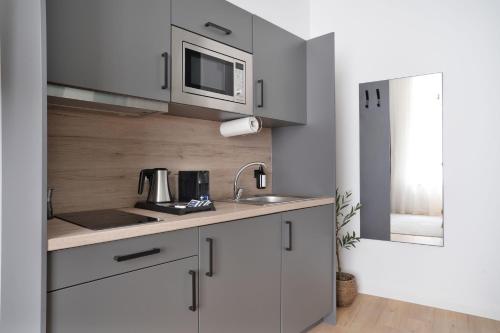 Η κουζίνα ή μικρή κουζίνα στο Zentrale Apartments I home2share