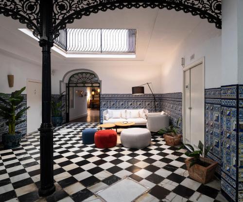 a living room with a couch and a table at La Central Sevilla in Seville