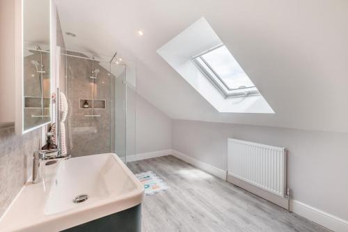 a bathroom with a sink and a skylight at 1 Bed in Marishes oc-l32534 in Kirby Misperton