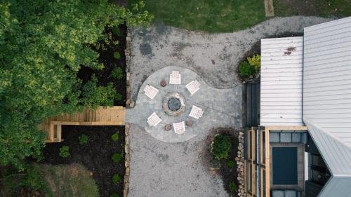 an overhead view of a backyard with a table at Riverstone Cottage A Cozy Riverfront Retreat in Dahlonega