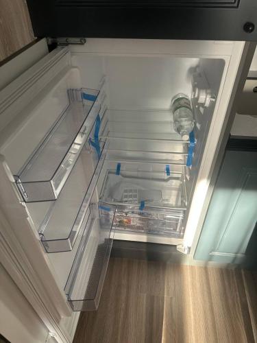 an empty refrigerator with its door open in a kitchen at Sea Home 9 in Sunny Beach