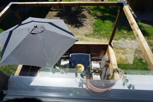 an umbrella sitting on top of a table at Chata Břeh in Louka