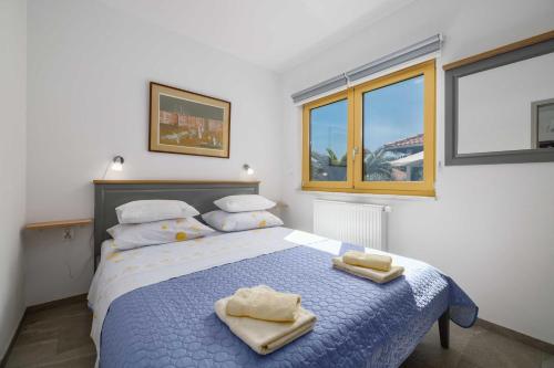 Posteľ alebo postele v izbe v ubytovaní Apartment Markič
