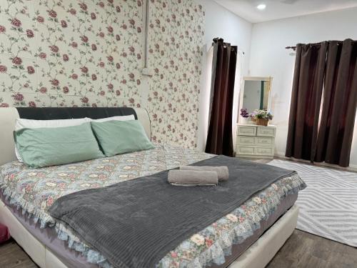 Ένα ή περισσότερα κρεβάτια σε δωμάτιο στο EasyOne Cottage Homestay