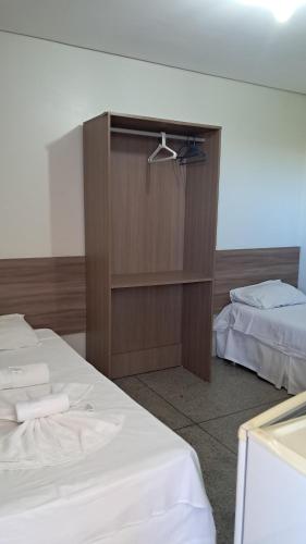 Una cama o camas en una habitación de Pousada Lagoa Seca