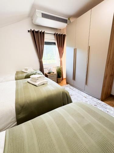 Ένα ή περισσότερα κρεβάτια σε δωμάτιο στο Villa Aurelia Wellness