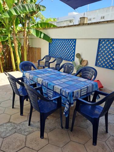 a blue table and chairs on a patio at Donna Cecilia in Santa Maria al Bagno